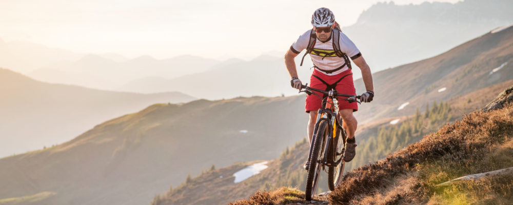 man biking - pelvic floor conditions treated by physical therapy